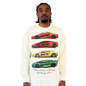 A man models the CAUTION TO THE WIND CREWNECK SWEATSHIRT CREME, featuring graphic prints of three supercars in red, yellow, and green with text beneath, standing against a plain white background.